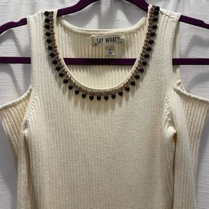 Say What? Beige open shoulder long sleeve dress.